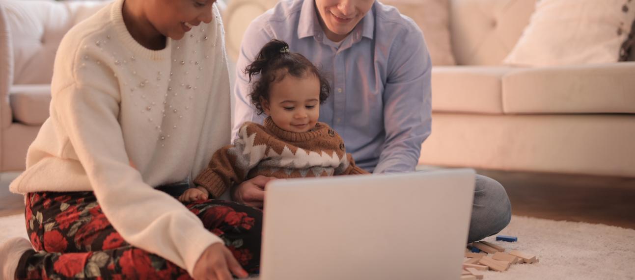 Family looking at laptop together